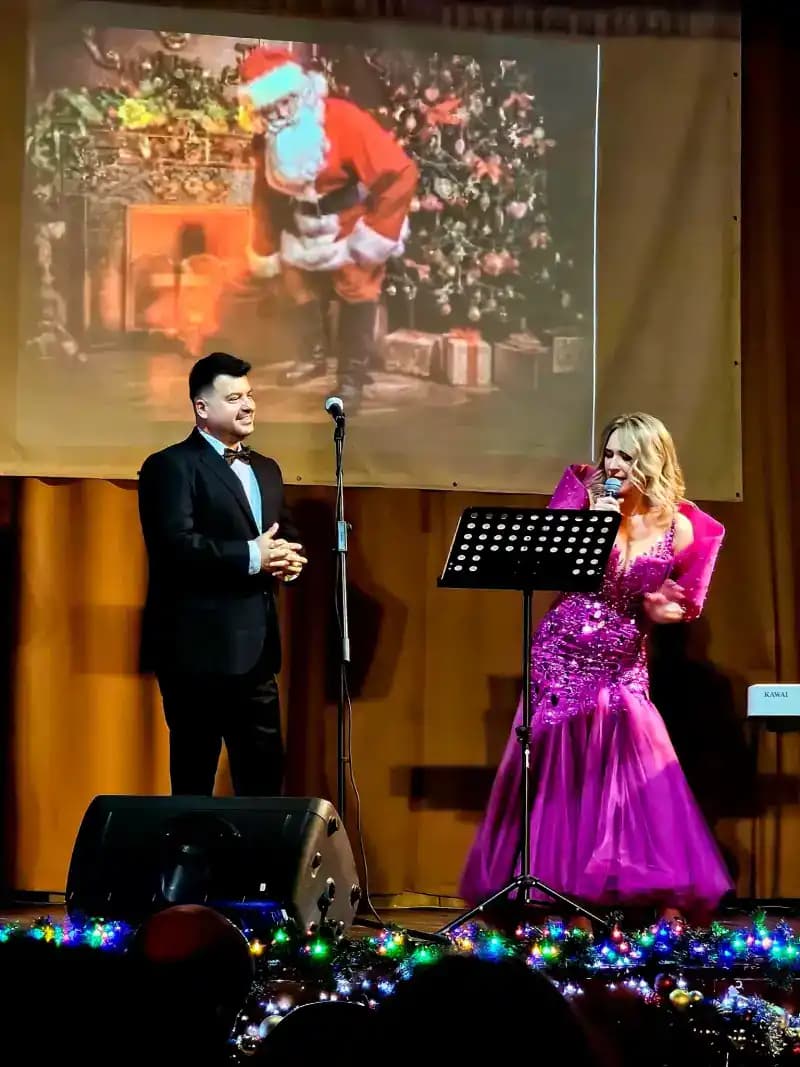 Gabriel Bîrjovanu performing on stage with symphony orchestra